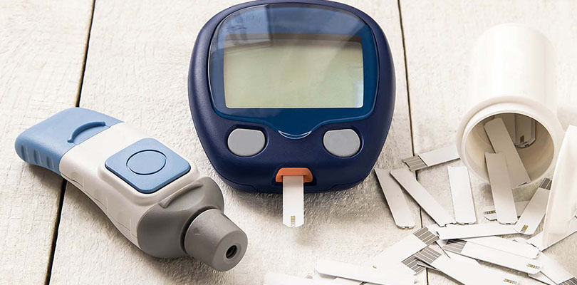 A type of glucose meter is on a table